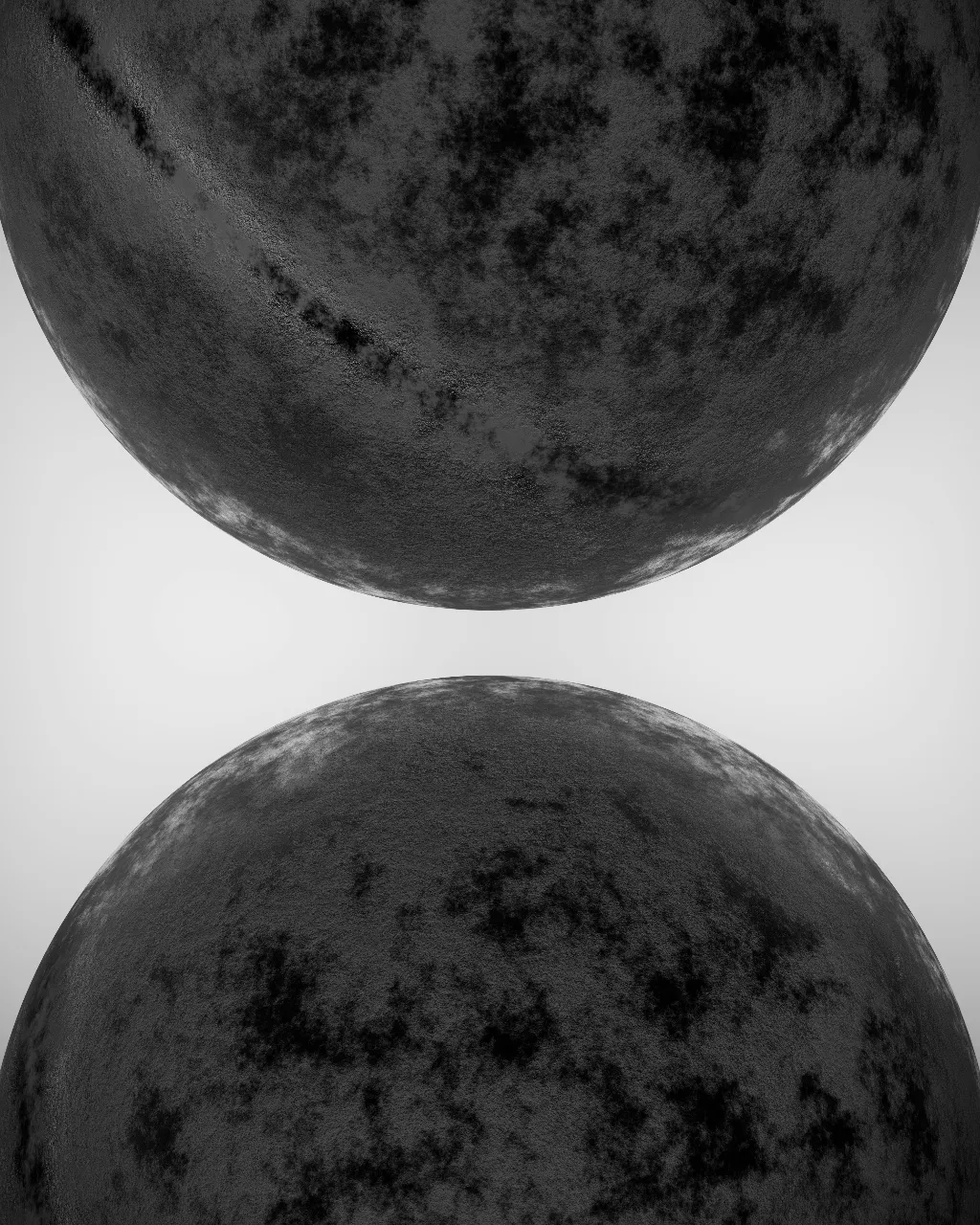 a black and white photo of two round objects