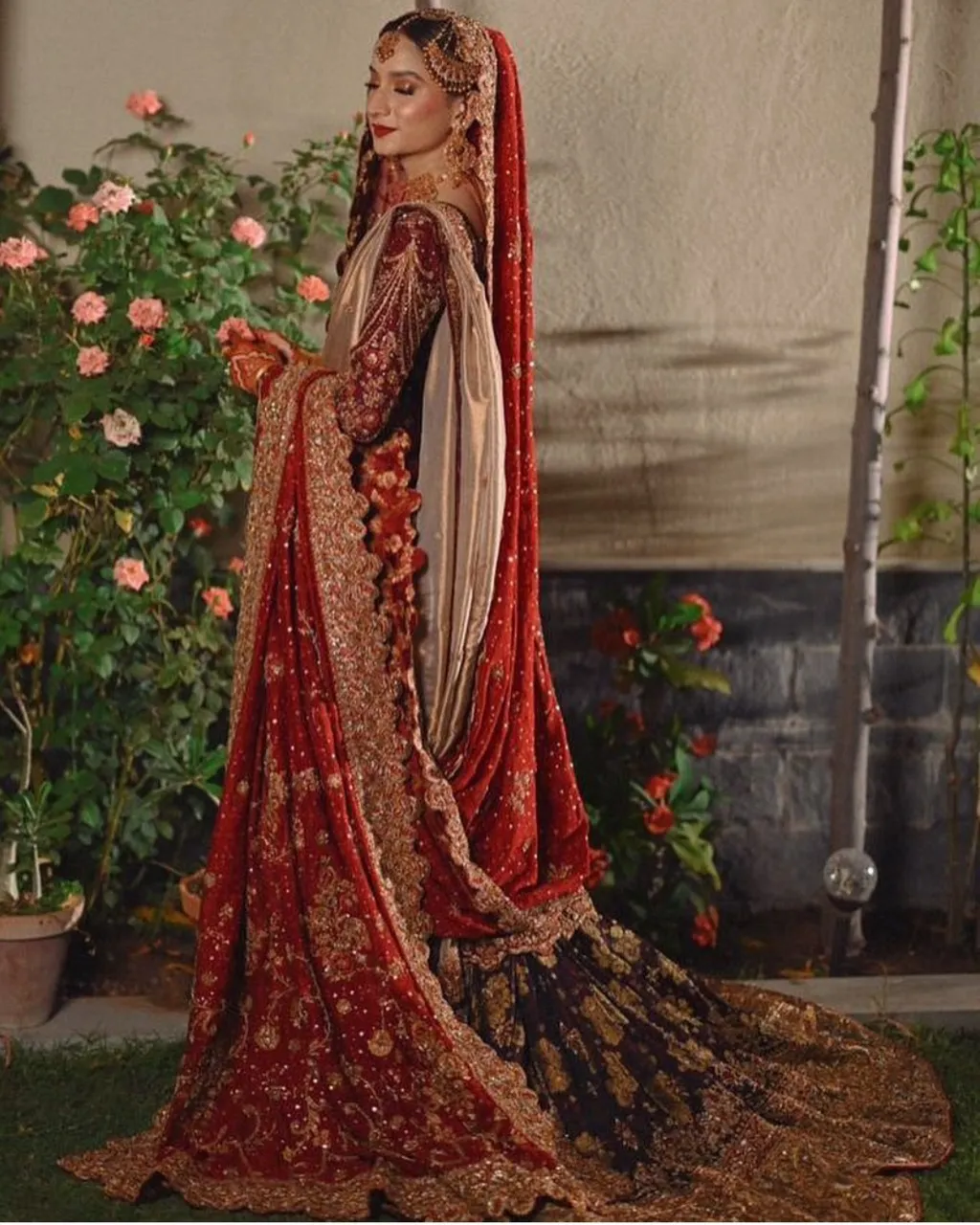 A bride in nontraditional bridal clothing, exploring an adapted landscape of oversized flowers with vibrant colors