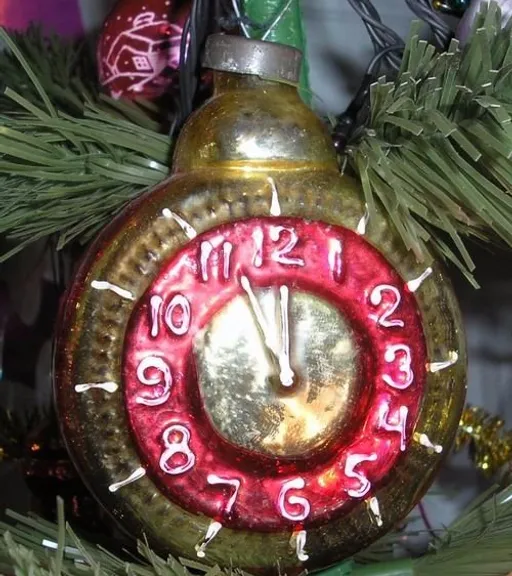 a clock is hanging on a christmas tree