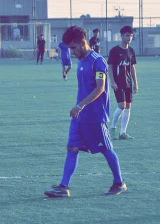 a group of young men playing a game of soccer