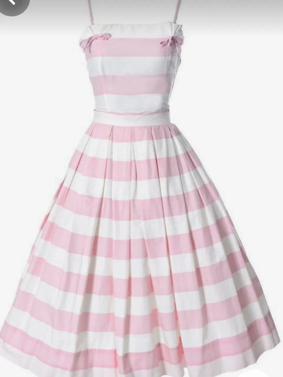 a pink and white dress barbie wearing this dress