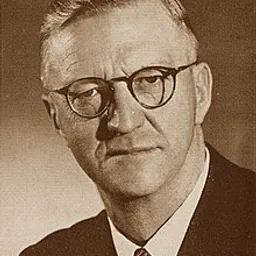 a black and white photo of Charles Robberts Swart wearing glasses, he was the first president of south africa