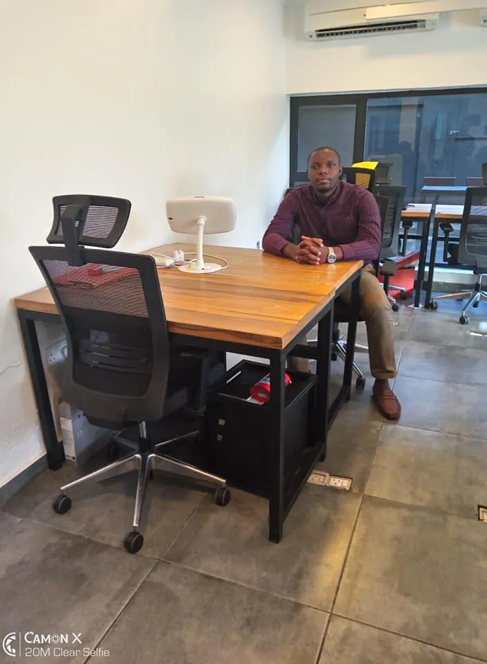 a man sitting at a desk in an office