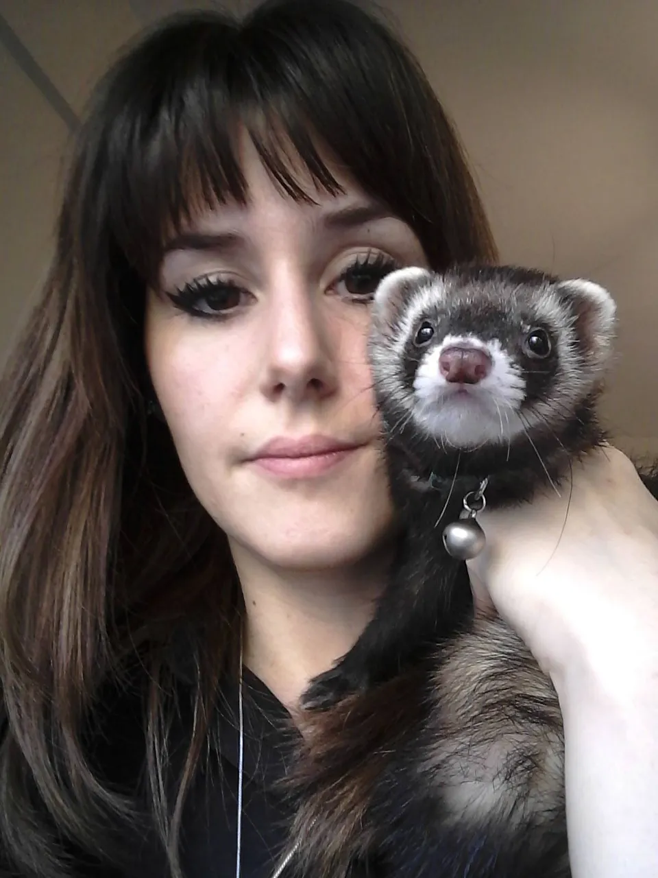 a woman holding a ferret up to her face, valorant,cyberpunk,extreme detail,hiperrealistic