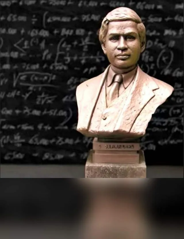 a bust of a man in front of a blackboard