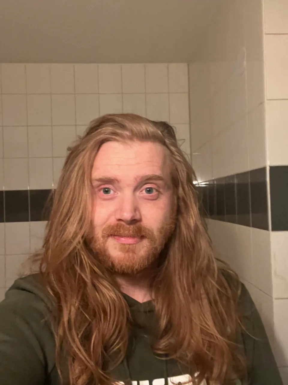 European long haired ginger guy in his mid 30’s symmetrical model shot, trimmed beard, highly detailed and hyper realistic eyes, epic ultra high quality billboard beauty footage, 