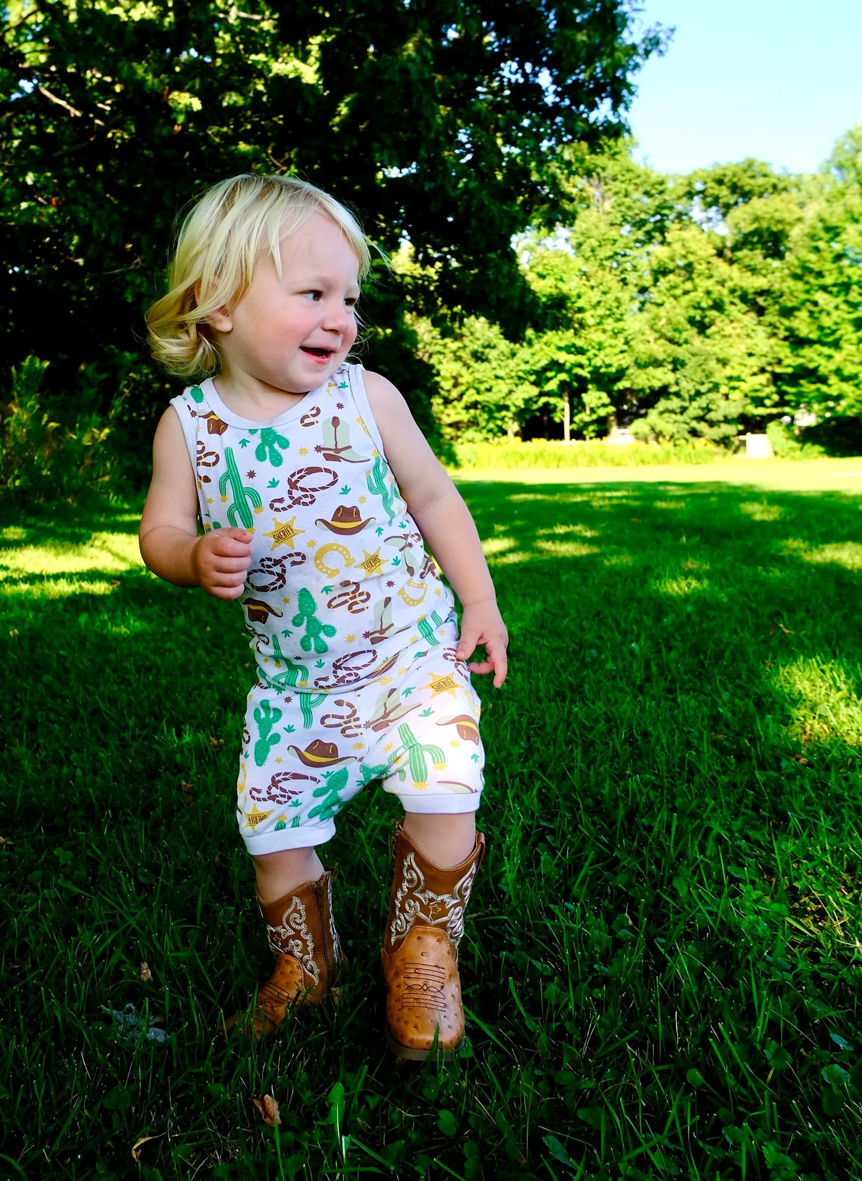 little boy dancing in the park, advertising style