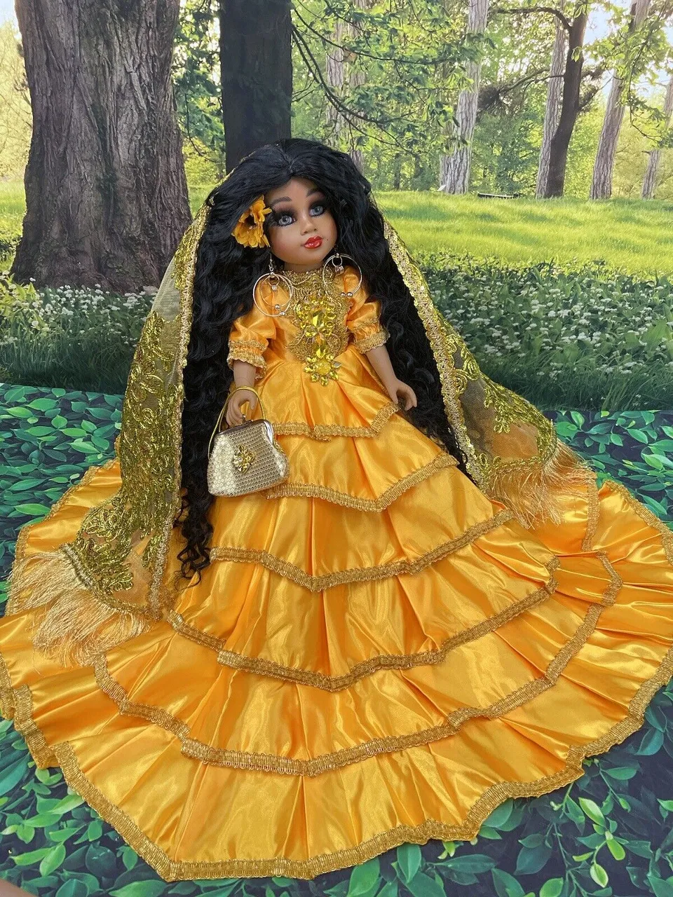 a doll is dressed in a yellow dress