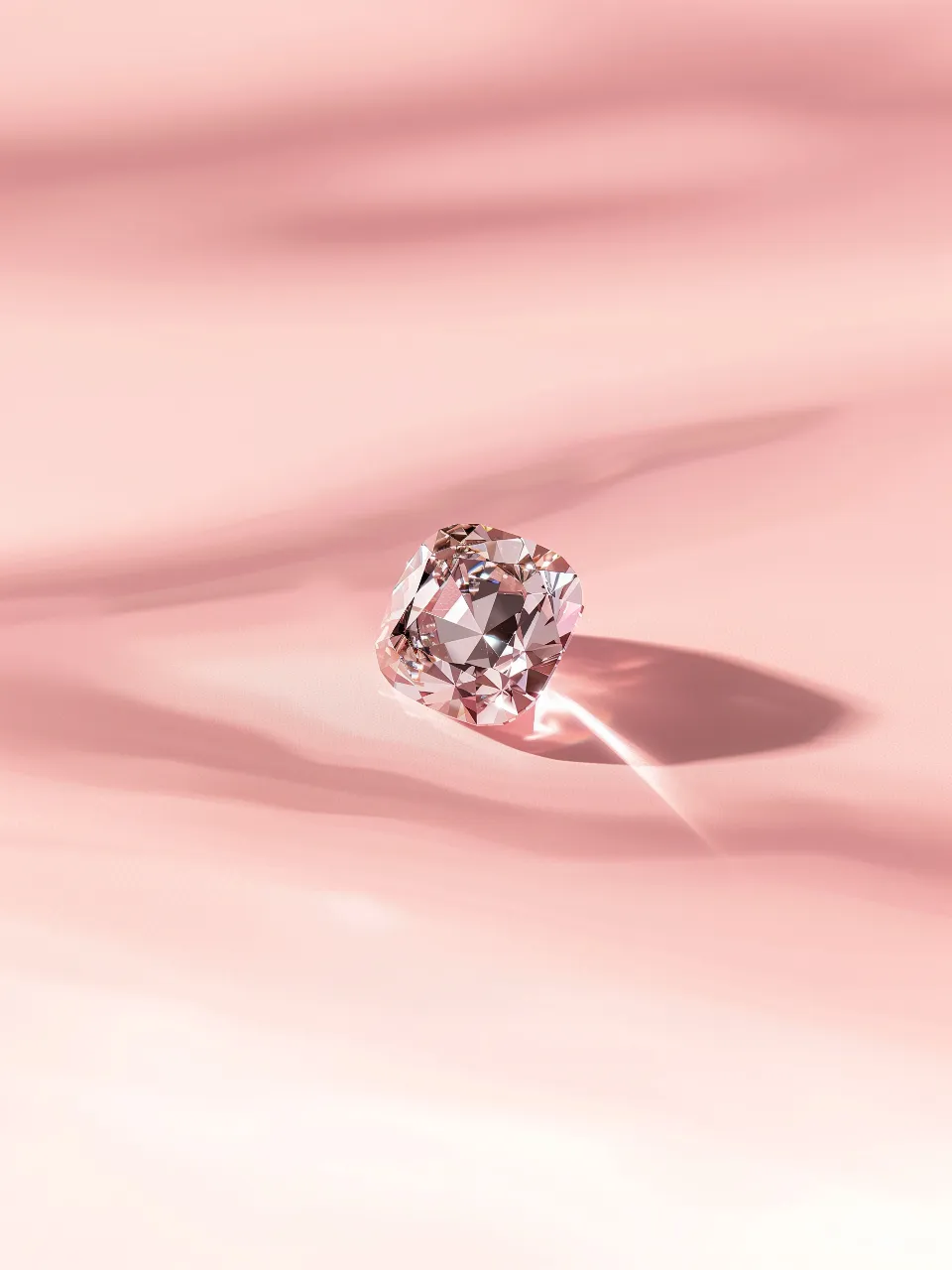 a pink diamond ring on a pink surface