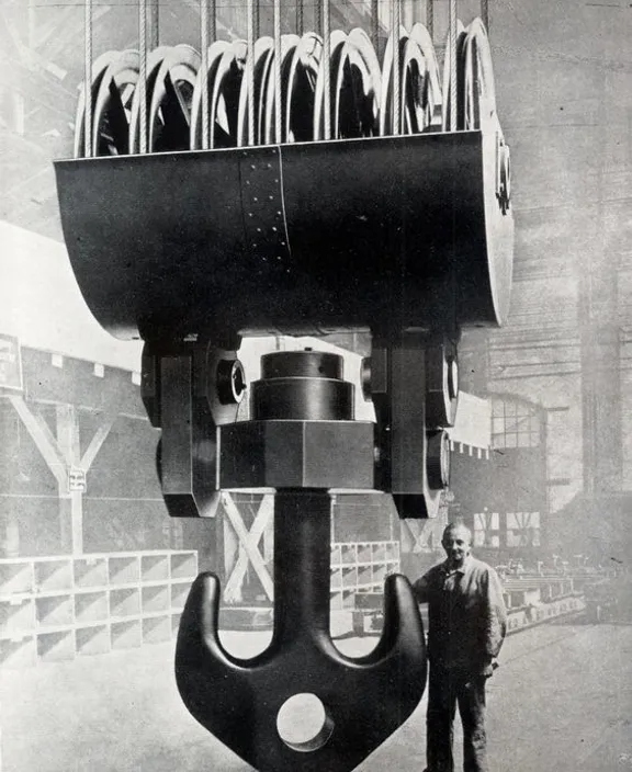 a man standing next to a large machine