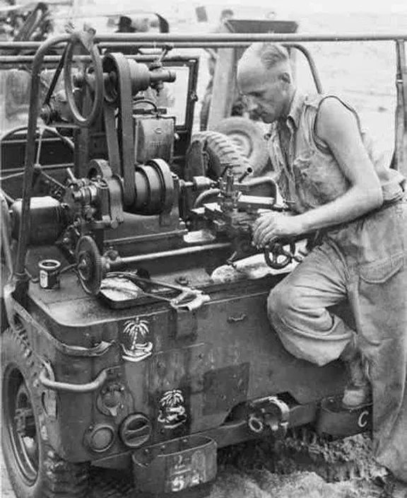 a man working on a machine in the water