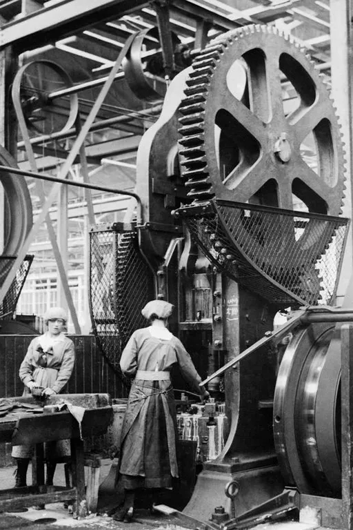 a couple of people that are standing in front of a machine