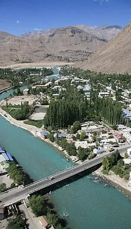 an aerial view of a city and a river