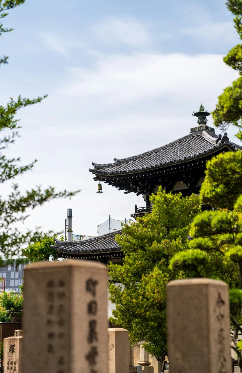 a pagoda in the middle of a cemetery in Osaka Japan