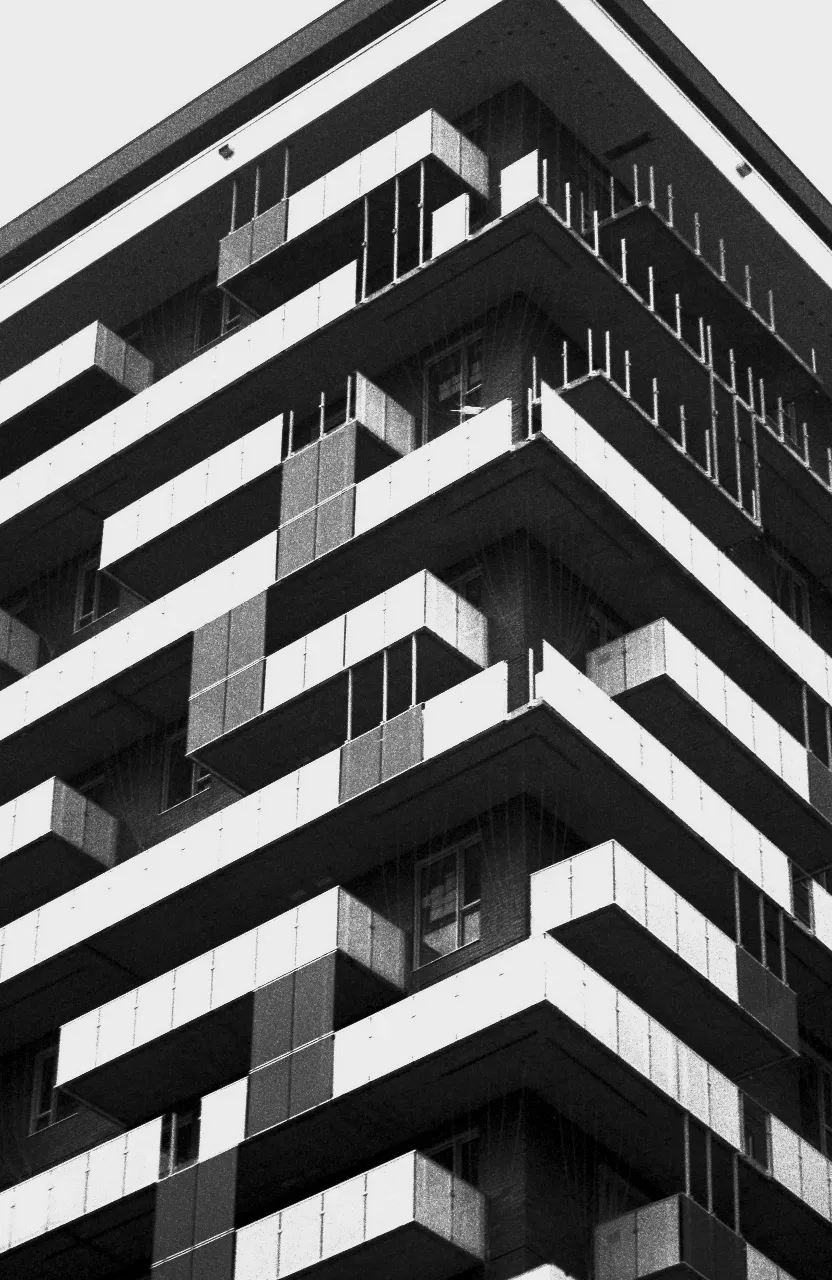 a black and white photo of a tall building