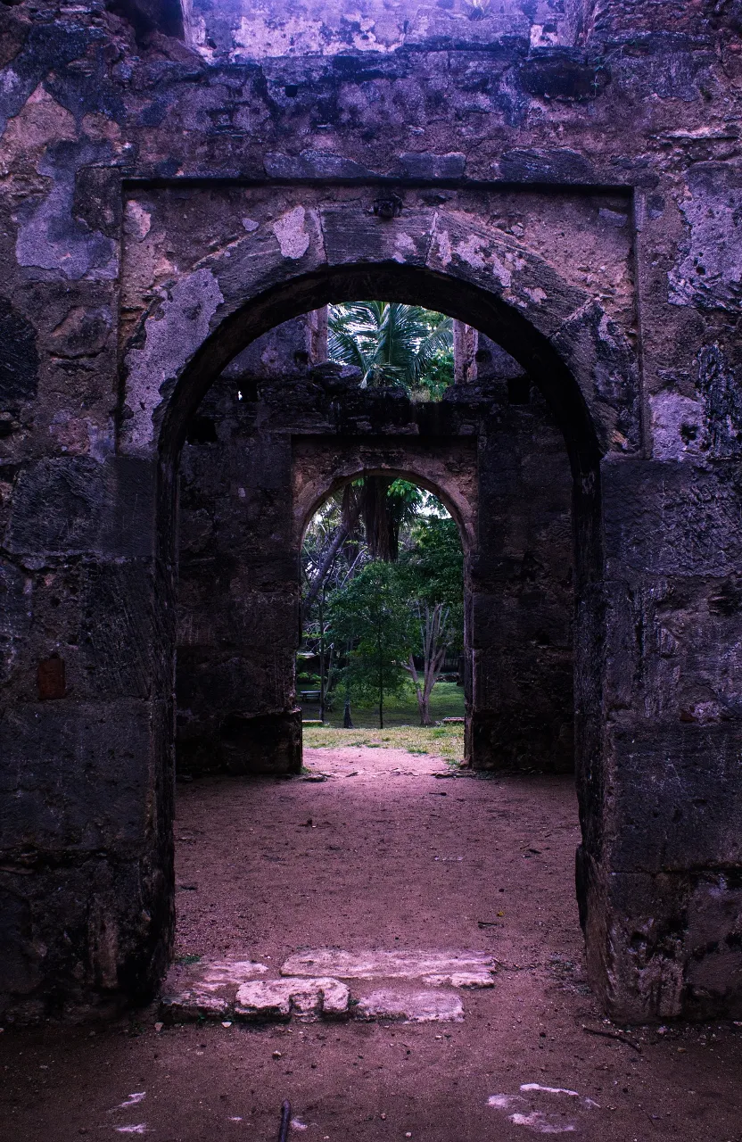 A creepy, gothic mansion with a mysterious portal that leads to a horror show