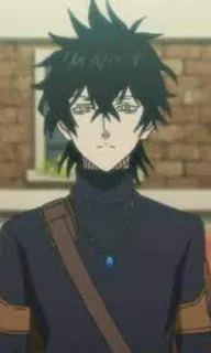 a man with black hair wearing a black shirt