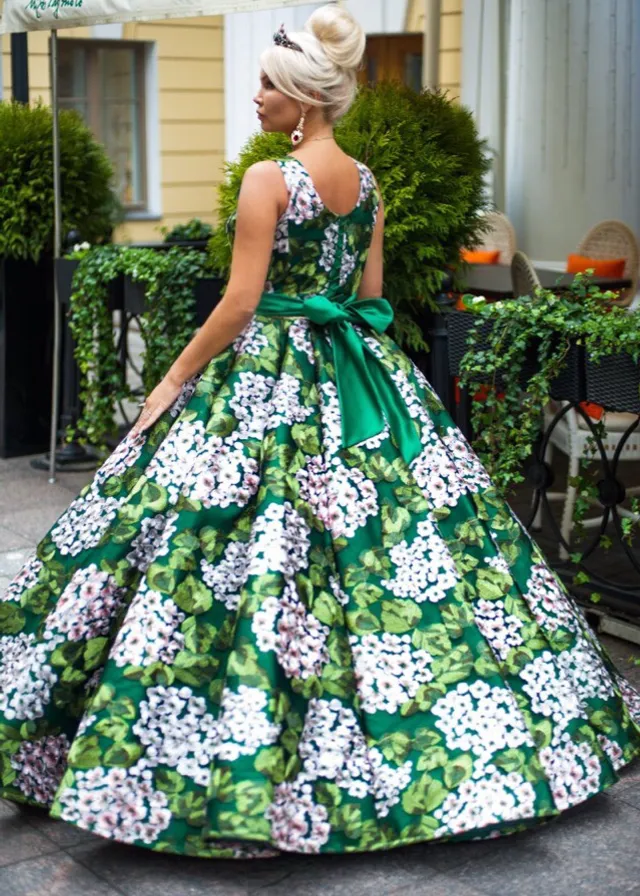 a woman in a green and white dress