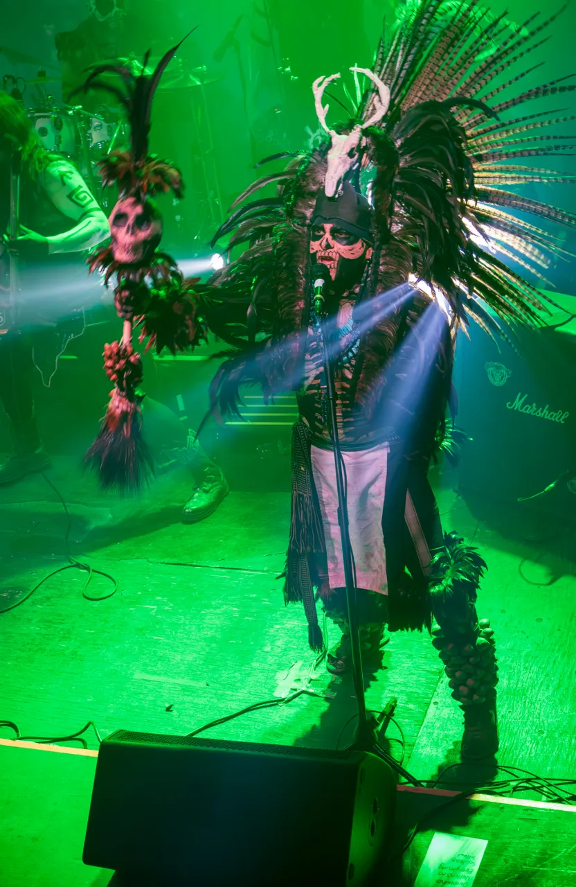 a man in a costume on stage with