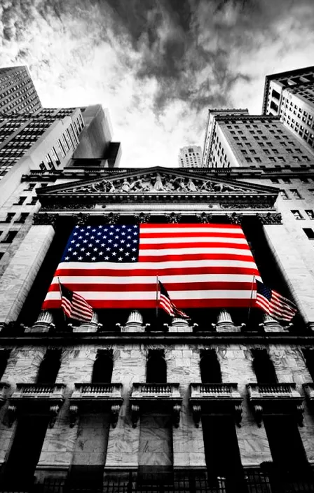 a large american flag on the side of a building