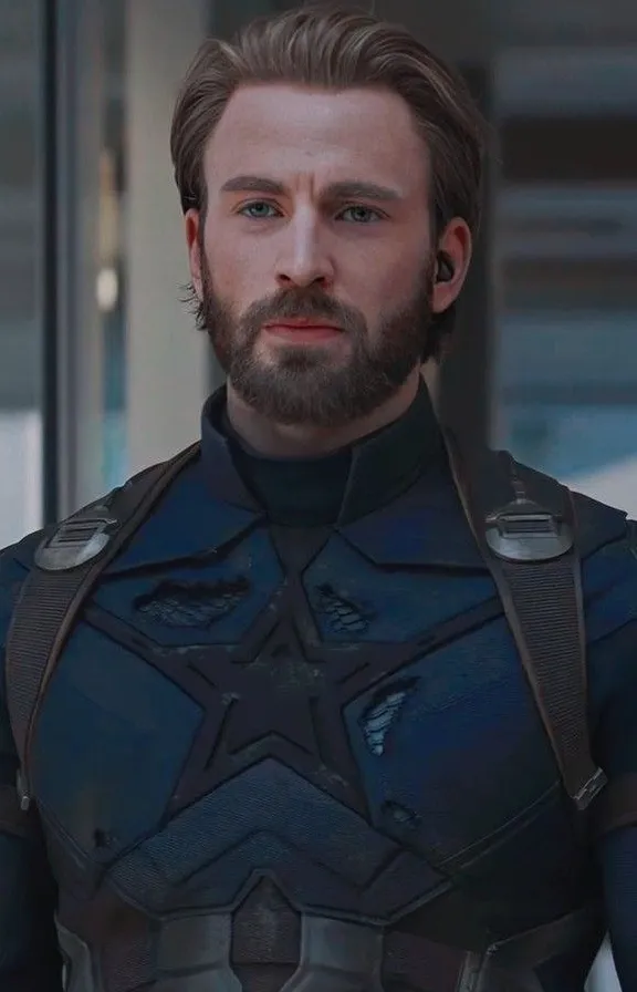 a man with a beard wearing a suit captain America