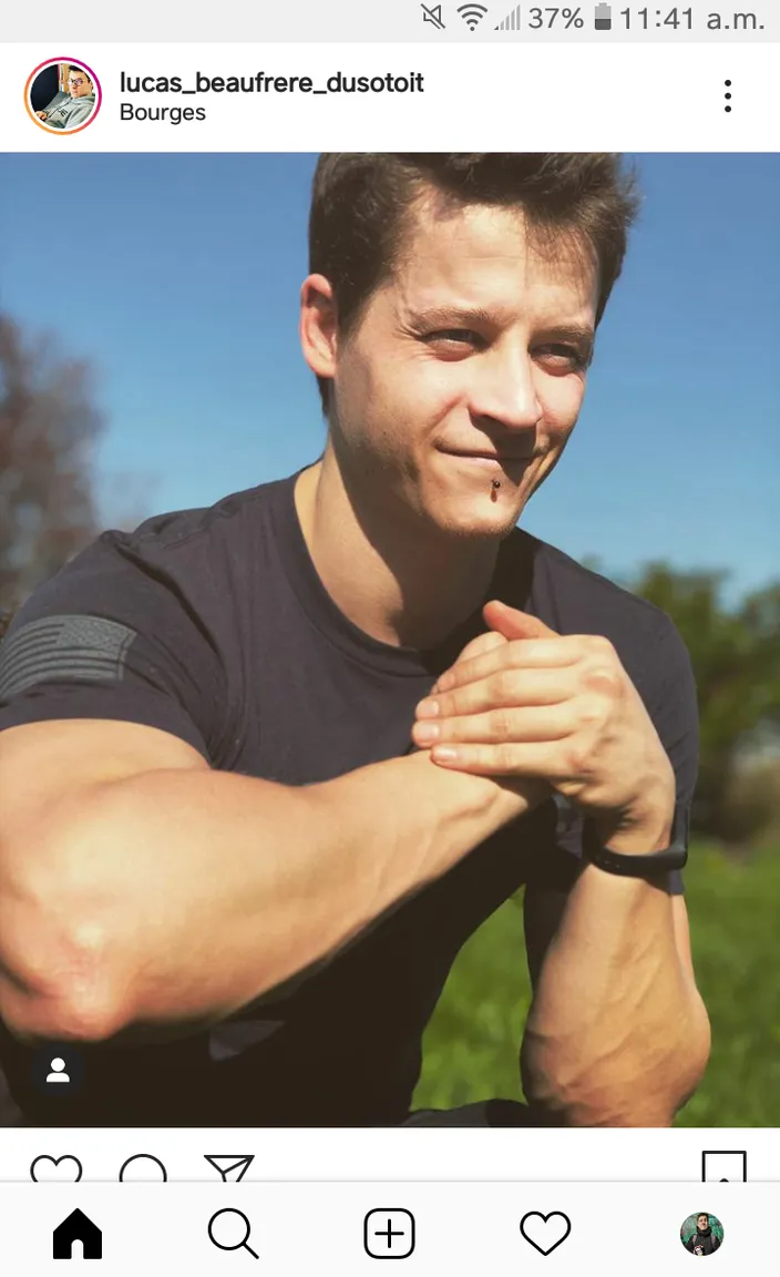 a man is smiling and posing for a picture