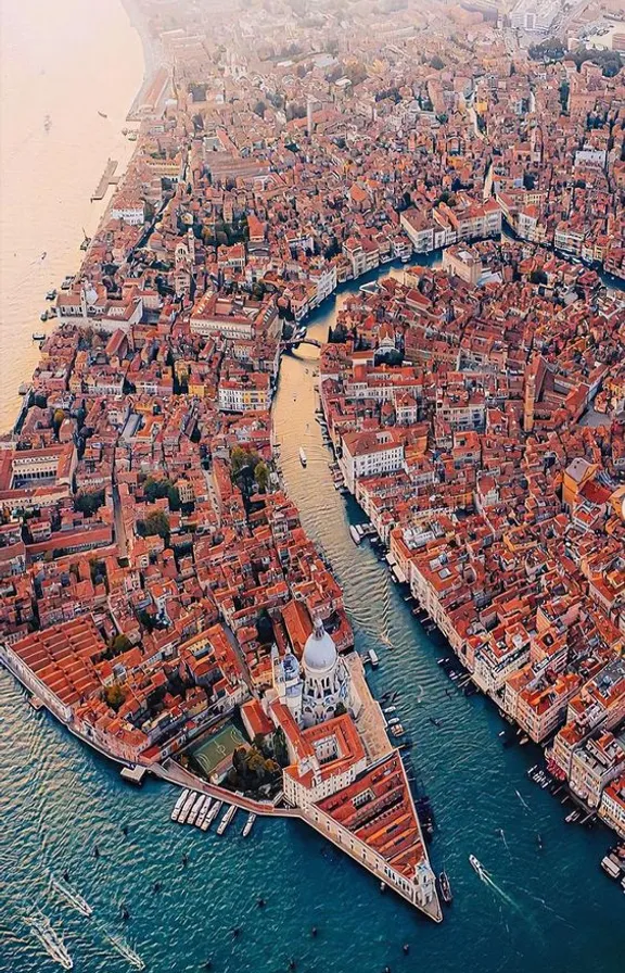 an aerial view of a city with a river running through it