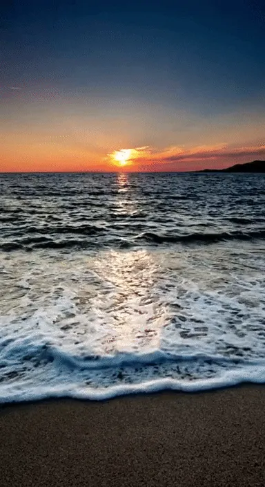 the sun is setting over the water at the beach