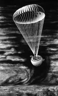 a black and white photo of a parachute