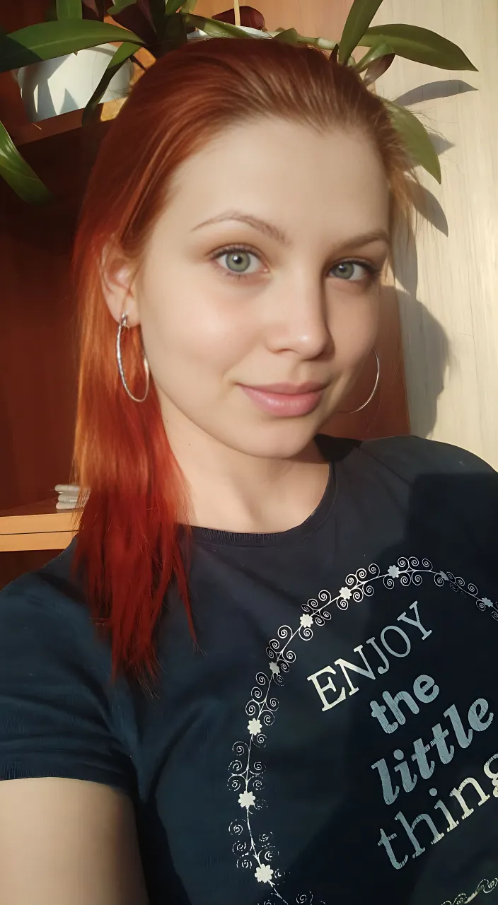 a fotorealism girl with red hair wearing a black shirt