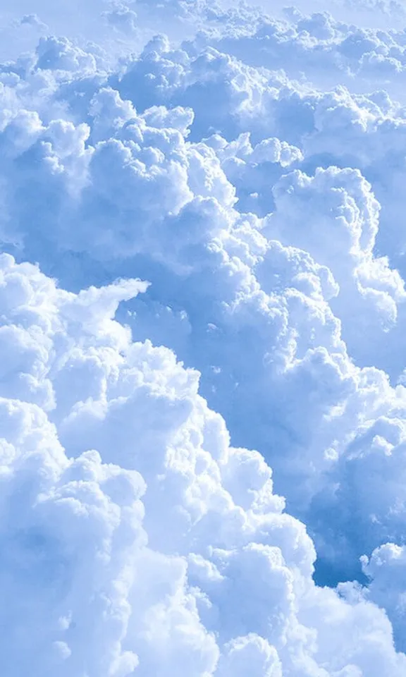 a view of the clouds from an airplane window