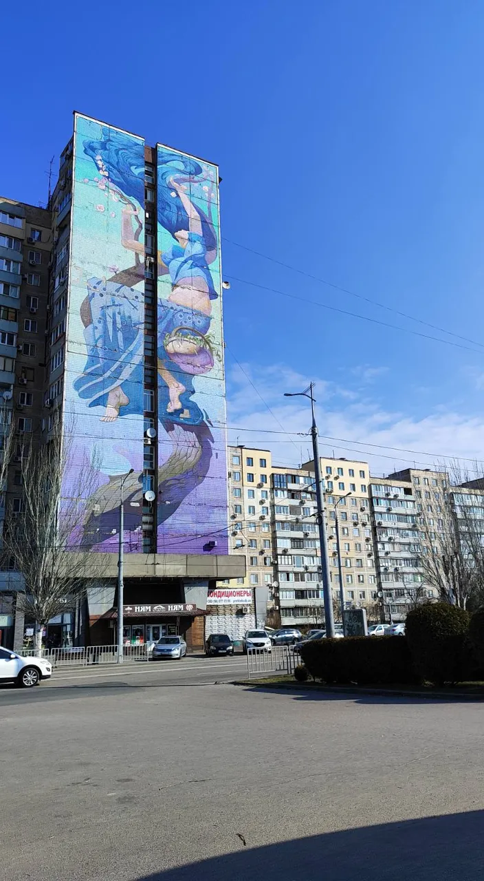 a large building with a mural on the side of it