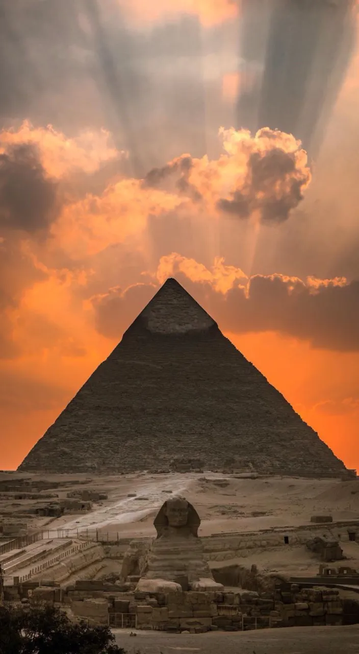 a very tall pyramid in the middle of a desert