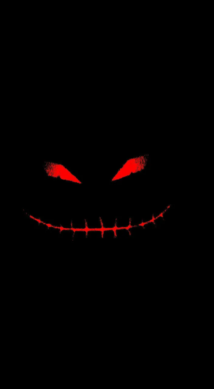 a creepy face with red eyes in the dark