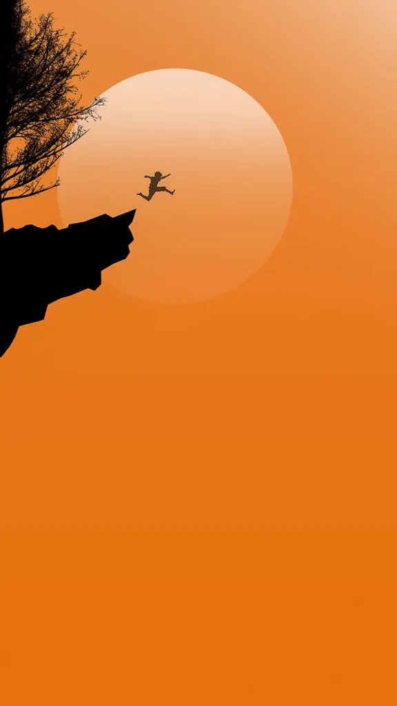 a person jumping off a cliff into the air