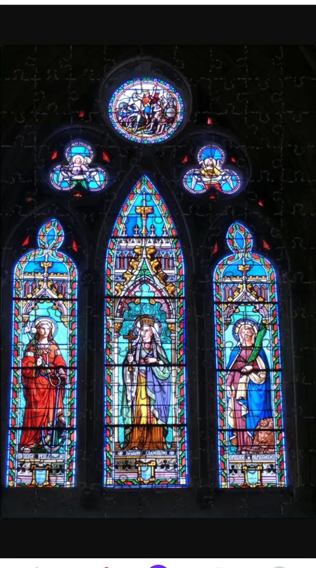 a large stained glass window in a church