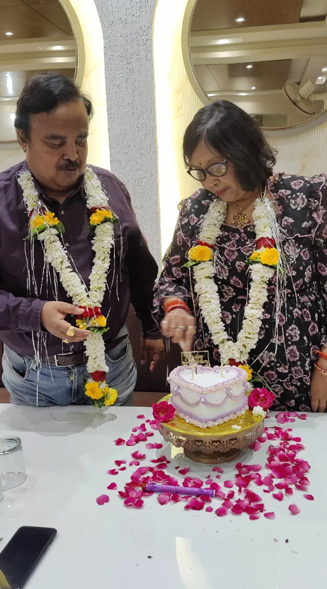 a man and a woman cutting a cake together marriage ceromony