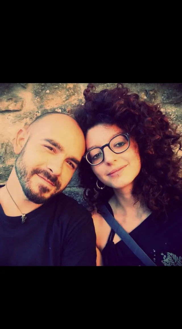 a man and a woman posing for a picture, happy, kiss, wind