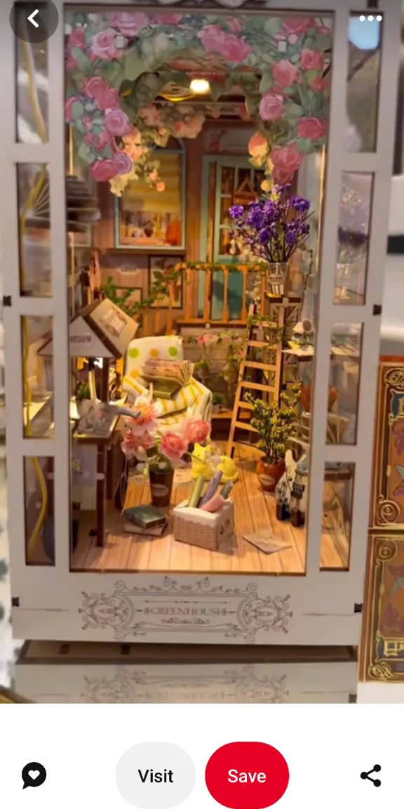 a doll house with a lot of furniture inside of it