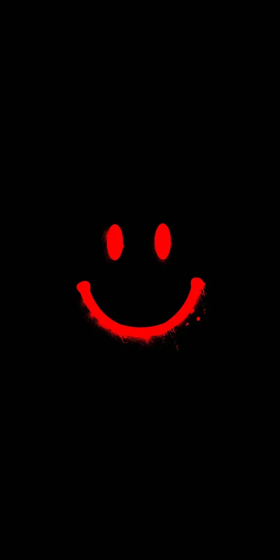 a red smiley face on a black background